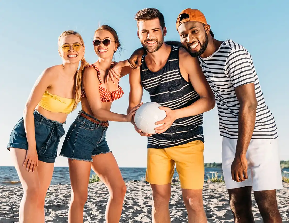 A group of men and women volleyball on a team.